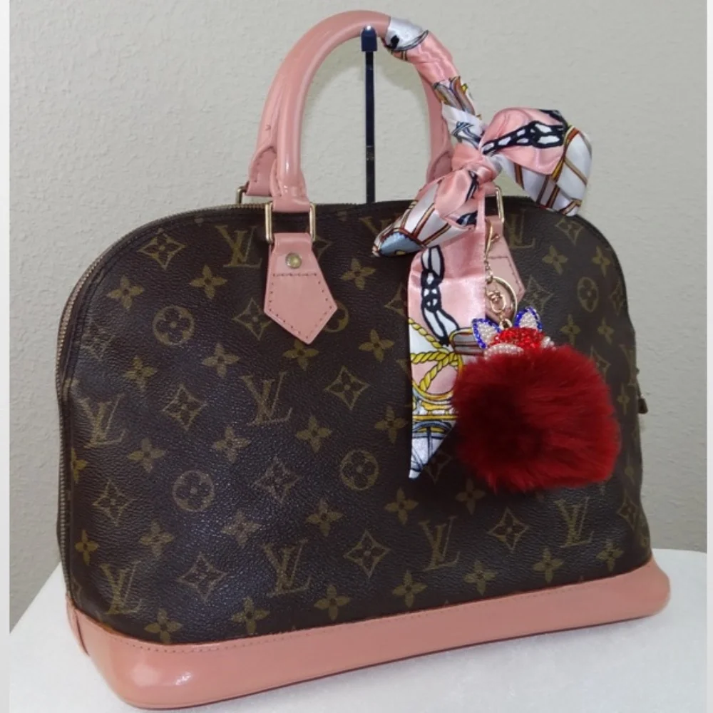 Louis Vuitton Brown Monogram Satchel with Pink Trim and Red Pom-Pom Charm